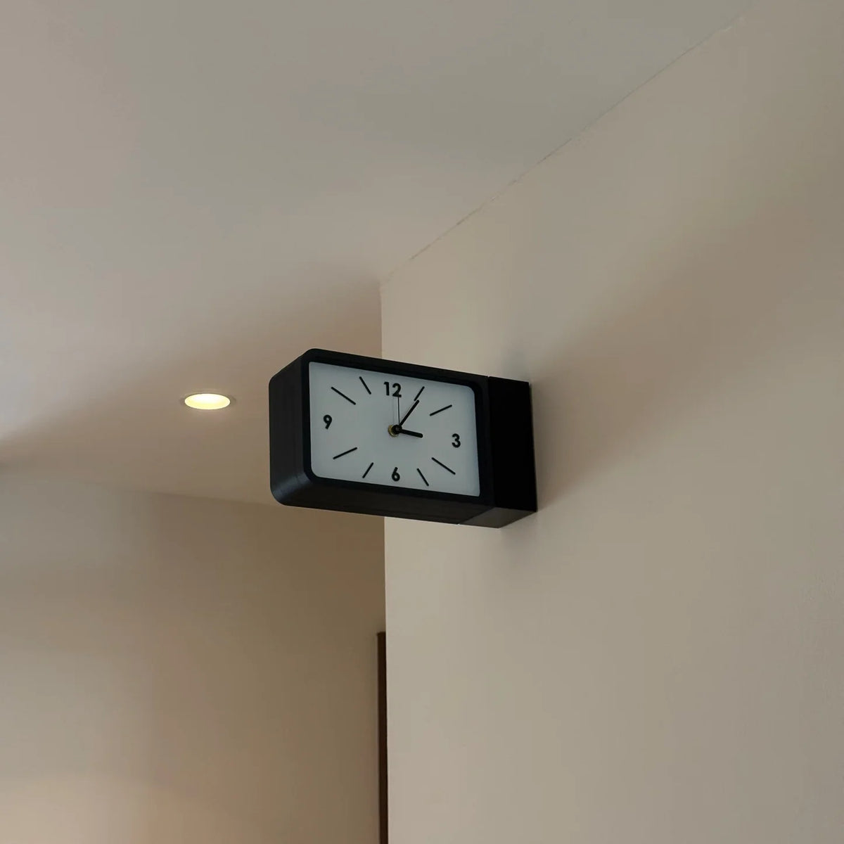 Dual sided wall clock