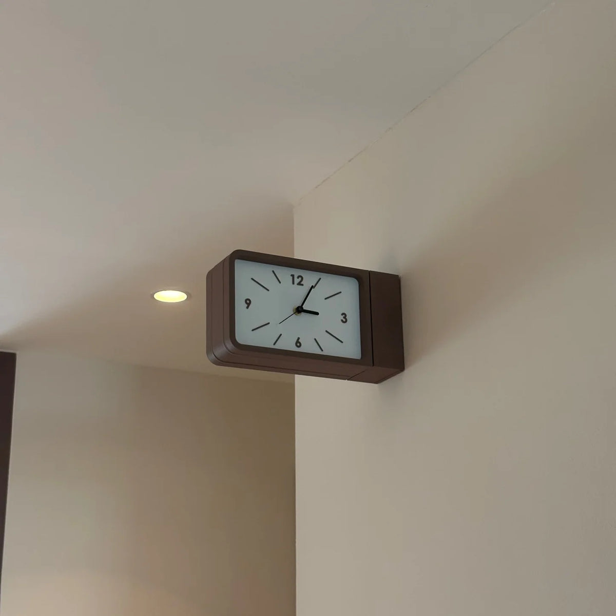 Dual sided wall clock
