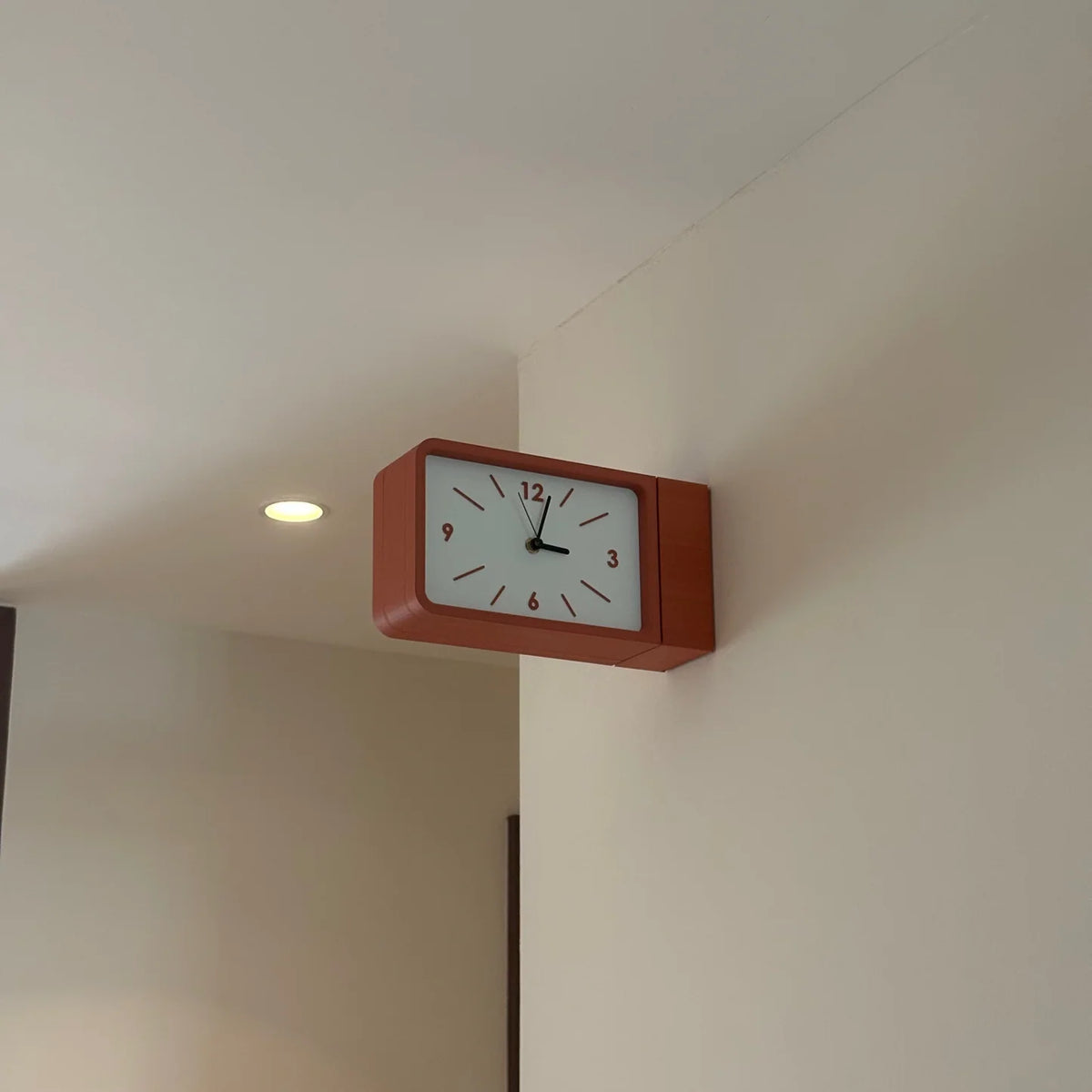 Dual sided wall clock
